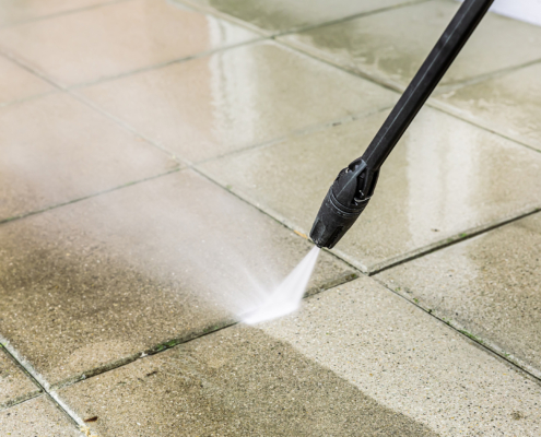 Detail of cleaning terrace with high-pressure water blaster