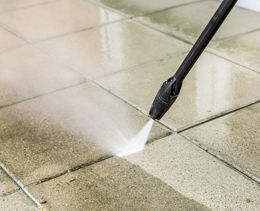 Detail of cleaning terrace with high-pressure water blaster